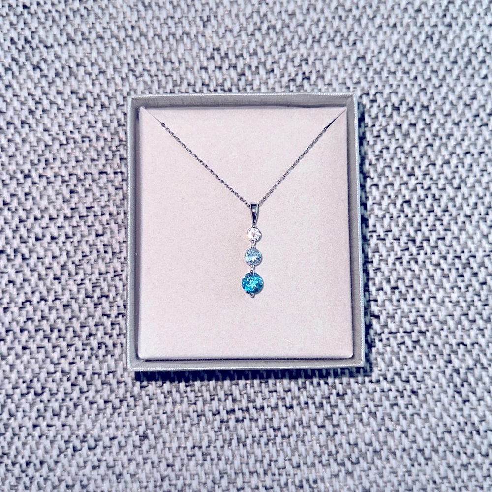 Blue and White Topaz Three Stone Pendant in Sterling Silver